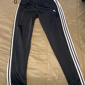 2 pairs of Nike warm ups and one pair of adidas warm up size small